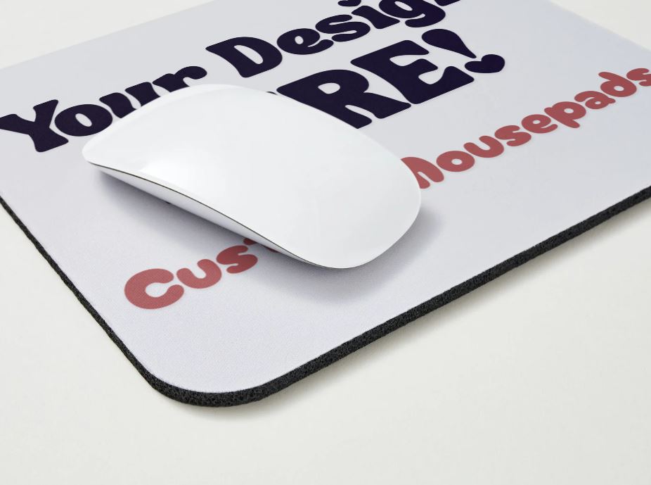 Mouse on a customizable mousepad with text 'Your Design Here!' and 'Custom Mousepads'.